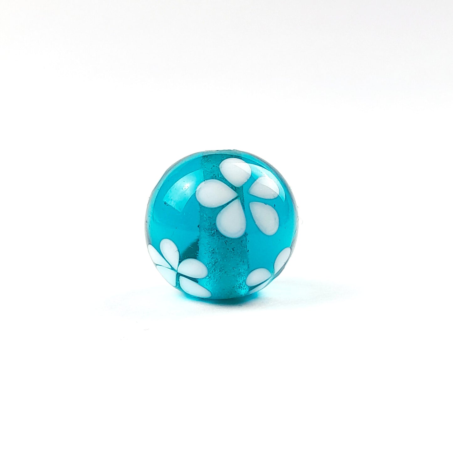 handgefertigte Glasperle dunkeltürkis Blüten