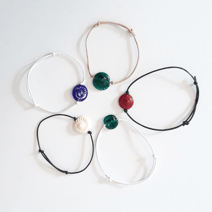 Armband mit handgedrehter Glasperle mit Schneckenabdruck