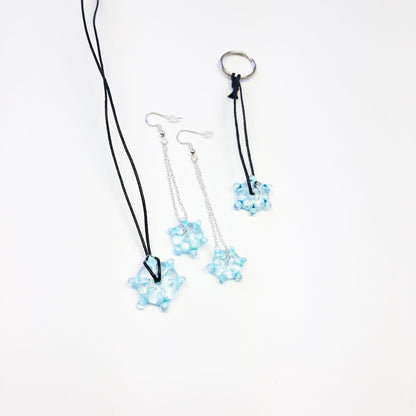 Handgedrehte Glasperle in Schneeflocken-Design