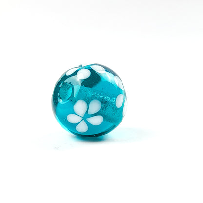 handgefertigte Glasperle dunkeltürkis Blüten